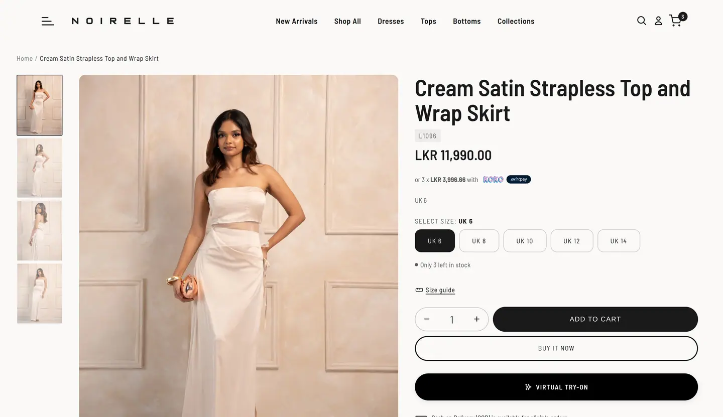Noirelle product page for a cream satin strapless top and wrap skirt